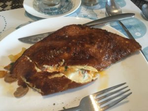 Omelette completely burned on the outside from the restaurant at Brody House in Budapest.