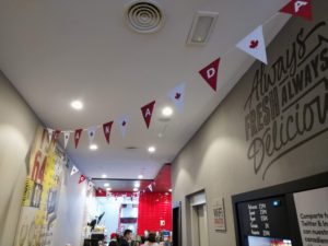 Canada flags inside Tim Hortons in Madrid