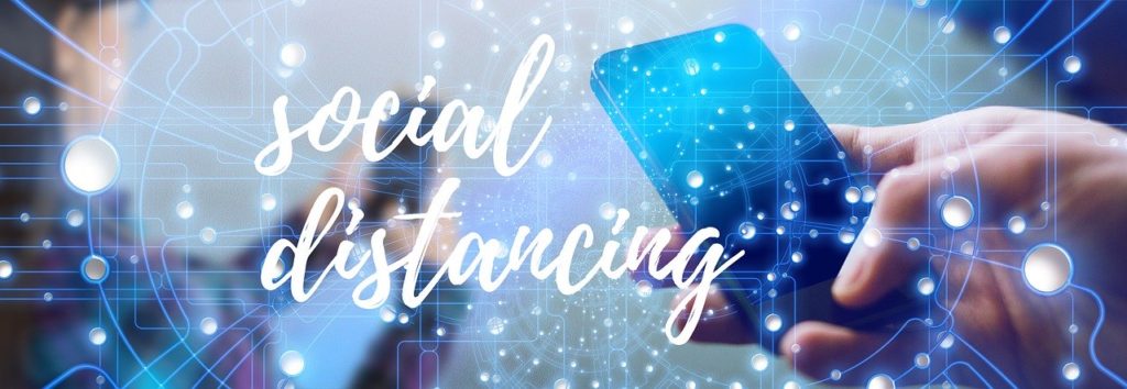 social distancing image with cell phone in hand